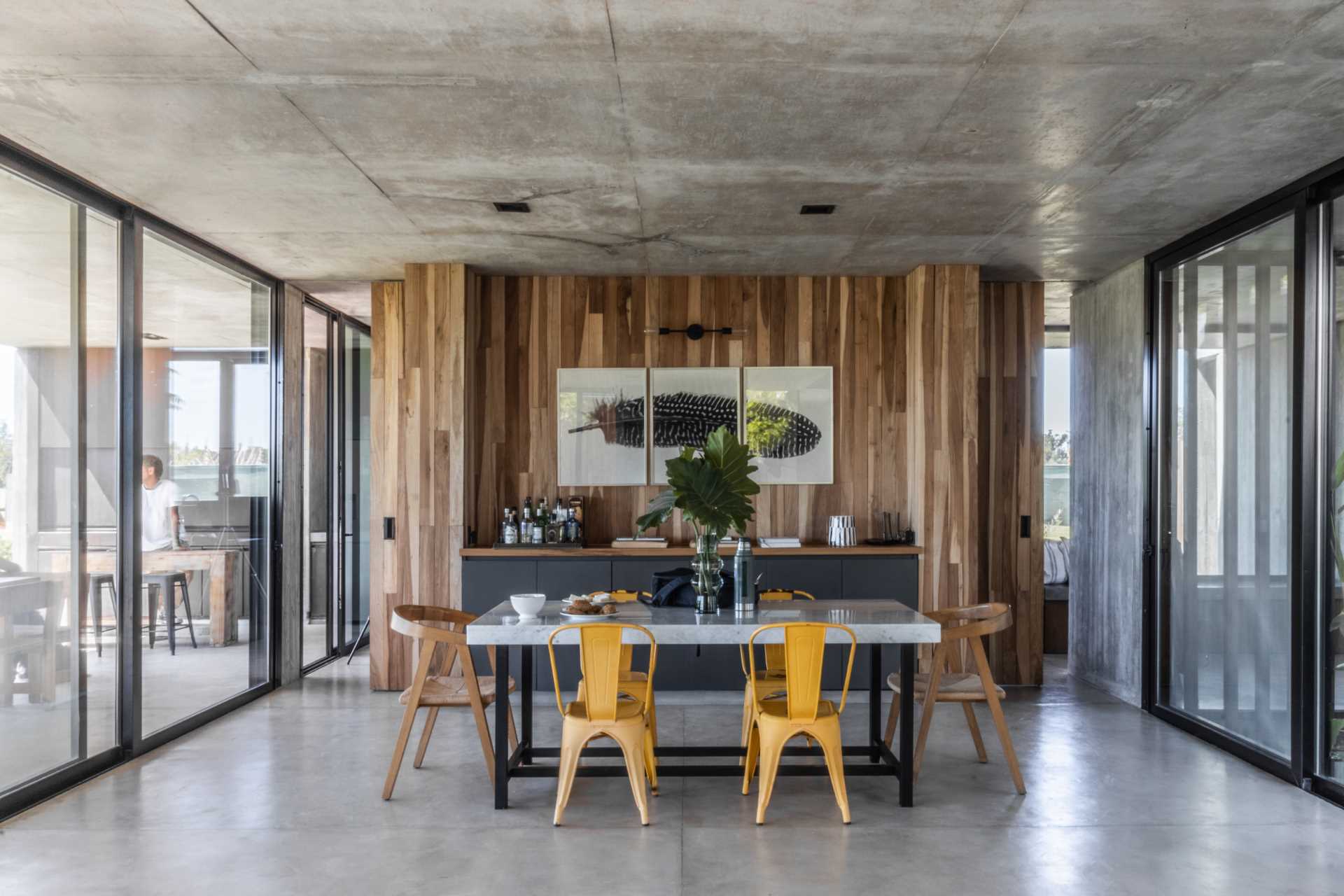 A modern home with a material palette of concrete and wood.