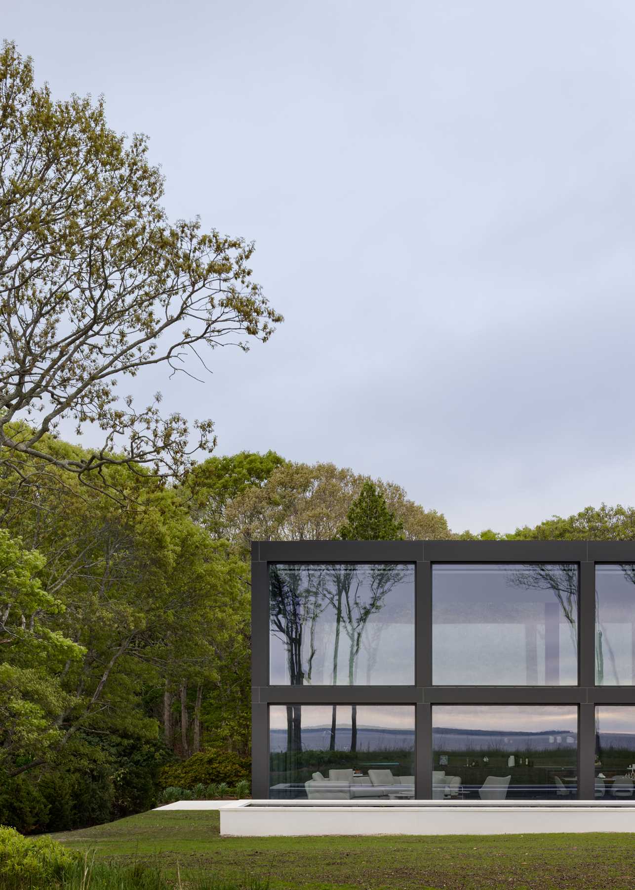 A modern home with a grid-inspired exterior and large windows.