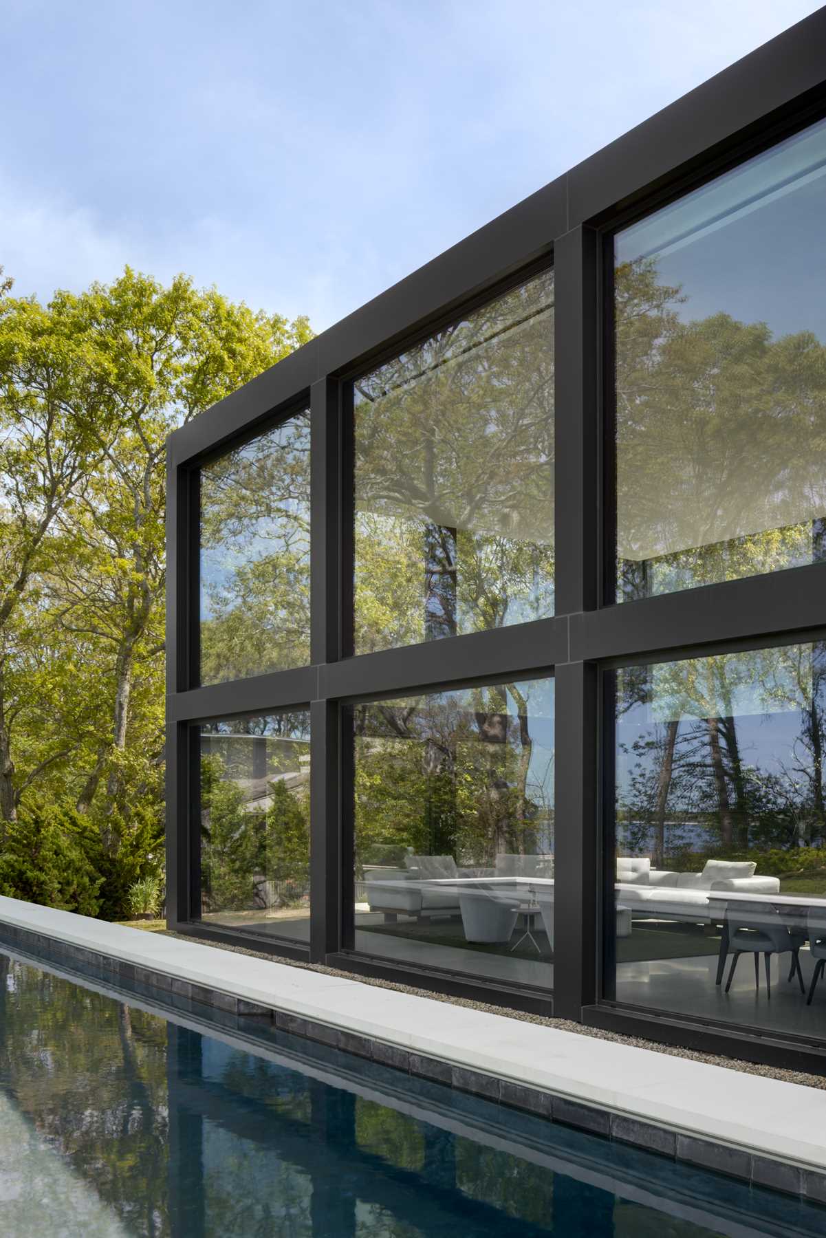 A modern home with a grid-inspired exterior and large windows.